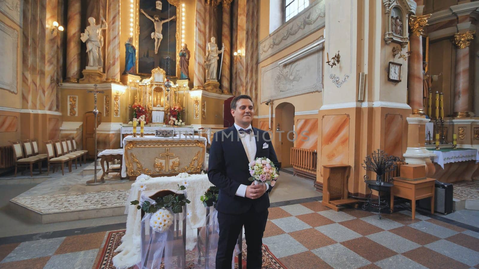 The groom expects his bride during a wedding in the Catholic Church