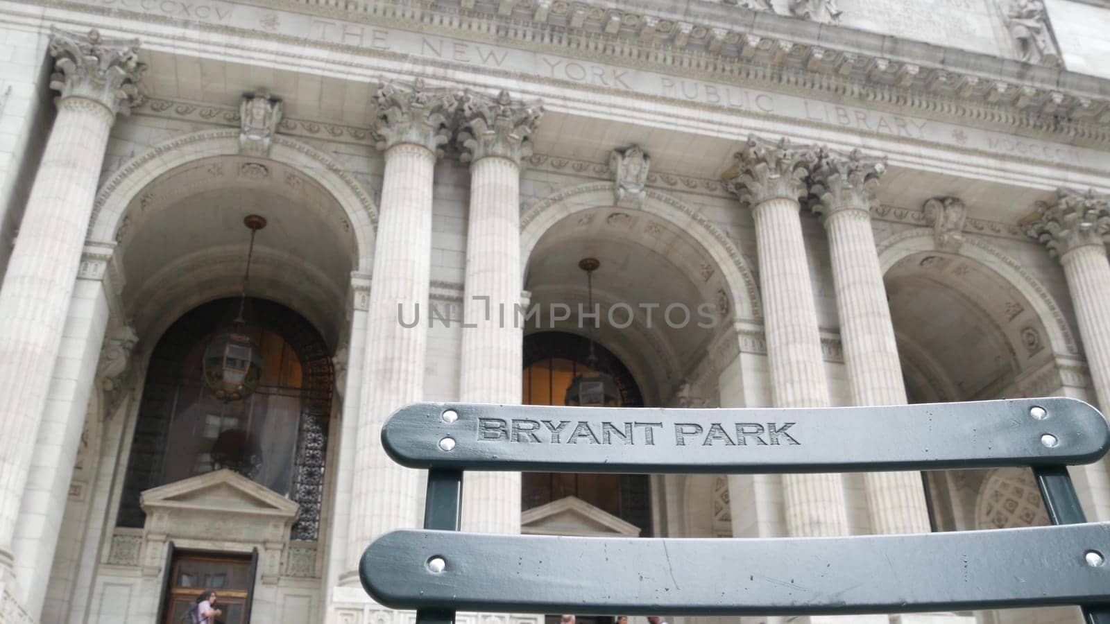 New York City, United States - 13 Sept 2023: Manhattan Midtown Bryant Park. Public library building architecture, 42 street and 5th Fifth 5 avenue. USA landmark. Facade exterior and sign on chair.