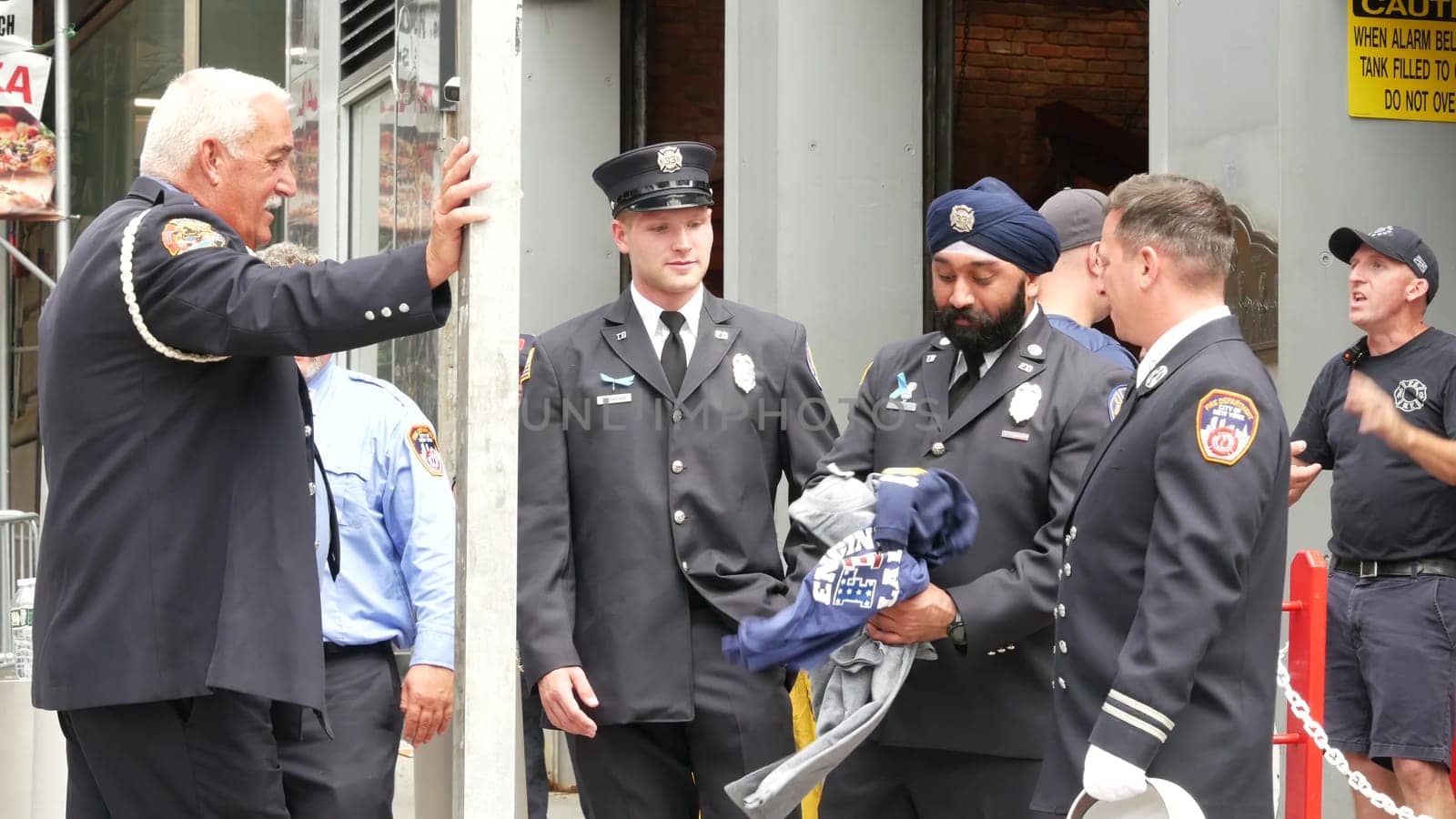 New York City, United States - 11 September 2023: Firefighters celebrate Patriot Day. 911 memorial remembrance event, FDNY commemorate anniversary. Fire Department Station, Manhattan 10 Ten Firehouse.
