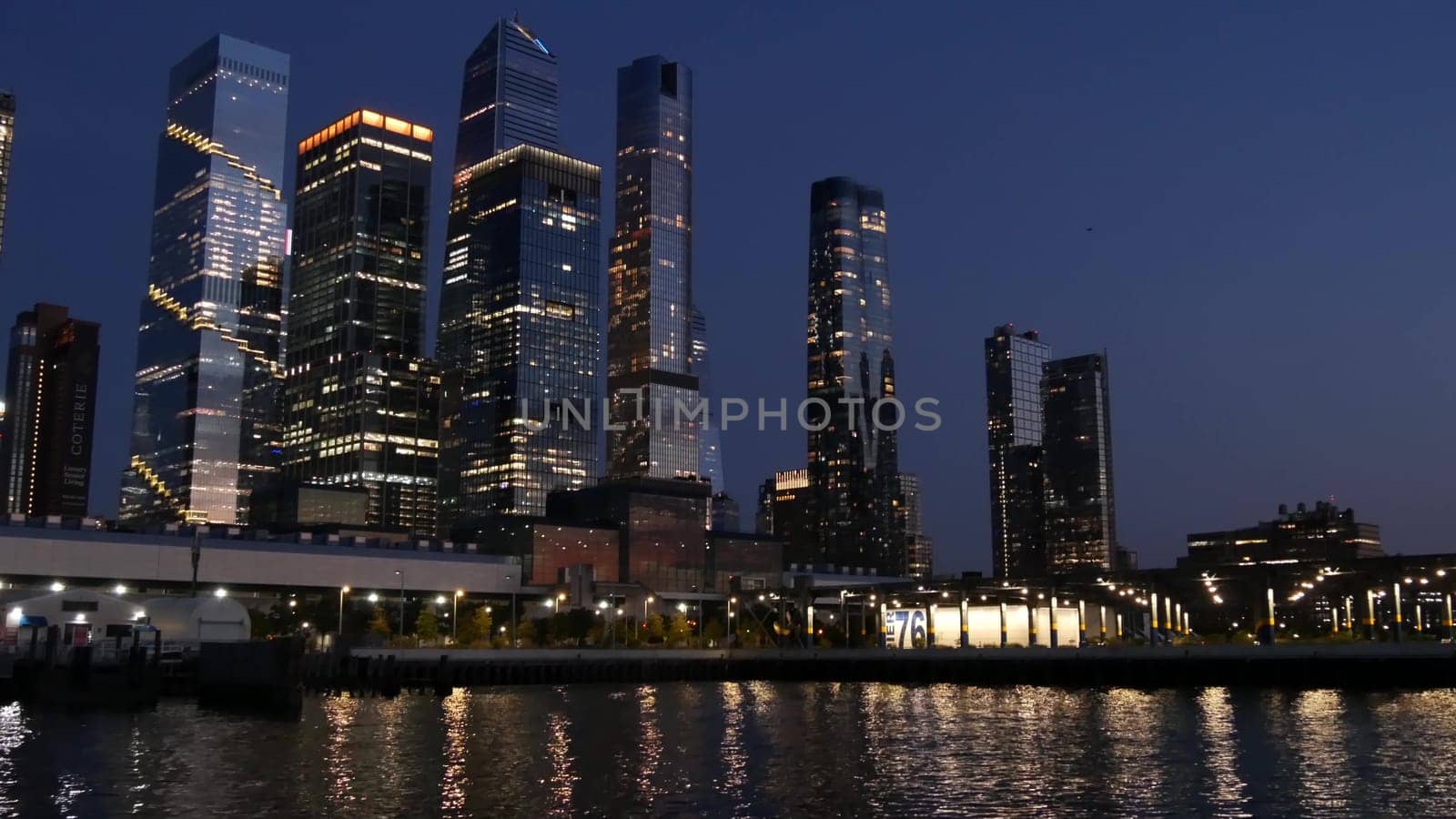 New York City, United States - 4 Sept 2023: Manhattan Midtown skyline from river ferry boat. Hudson Yards skyscrapers from ferryboat. Waterfront panorama, riverfront buildings architecture.