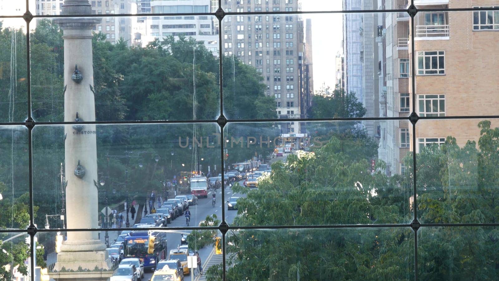 New York City, United States - 14 Sept 2023: Columbus Circle on Broadway street near Central Park. Manhattan Midtown architecture, USA. Urban life, road car traffic thru window of Deutsche Bank Center