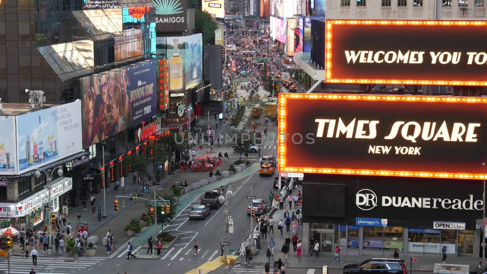 New York City, United States - 14 Sept 2023: Times Square, Manhattan Midtown Broadway street, USA. American NYC urban road traffic, people crowd from above. Commercial illuminated billboard screens.