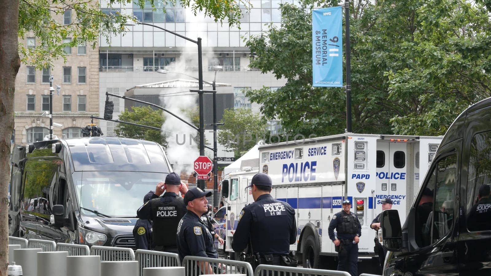 New York City, United States - 11 September 2023: Firefighters celebrate Patriot Day. Police cars, officers near 911 Memorial Pools. NYPD near Fire Department Station, Manhattan 10 Ten Firehouse, USA.