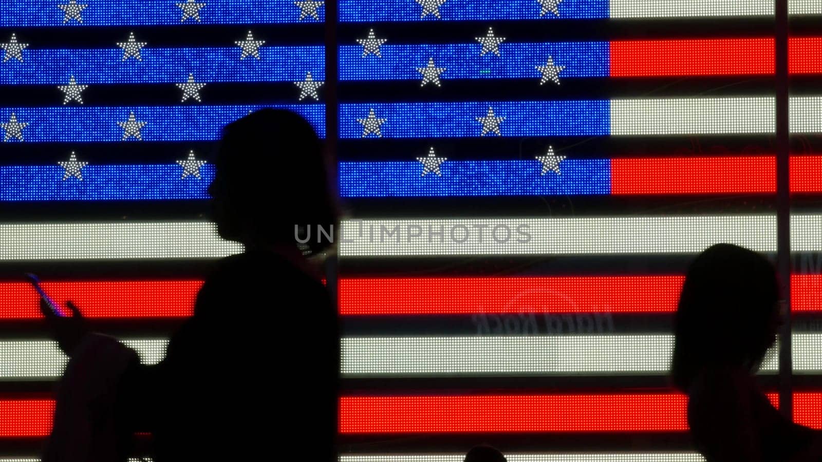 New York City, United States - 5 Sept 2023: Times Square, Manhattan Midtown Broadway street, USA. American flag, NYC urban life. Military island, army recruiting. People pedestrians silhouettes, crowd