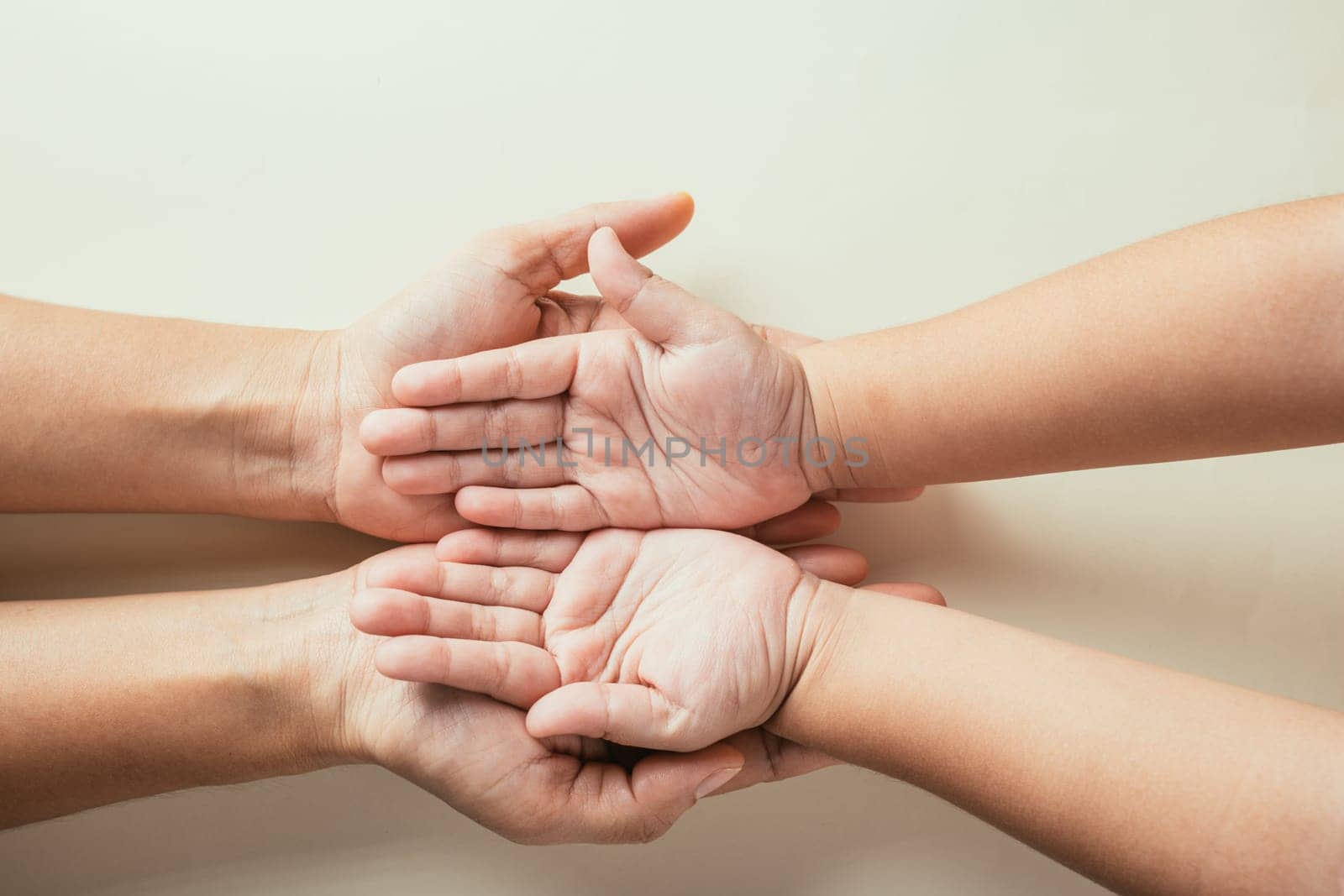 Celebrating Family Day, Parents and kid holding empty hands top view isolated. Embracing togetherness support and the legacy of generations.