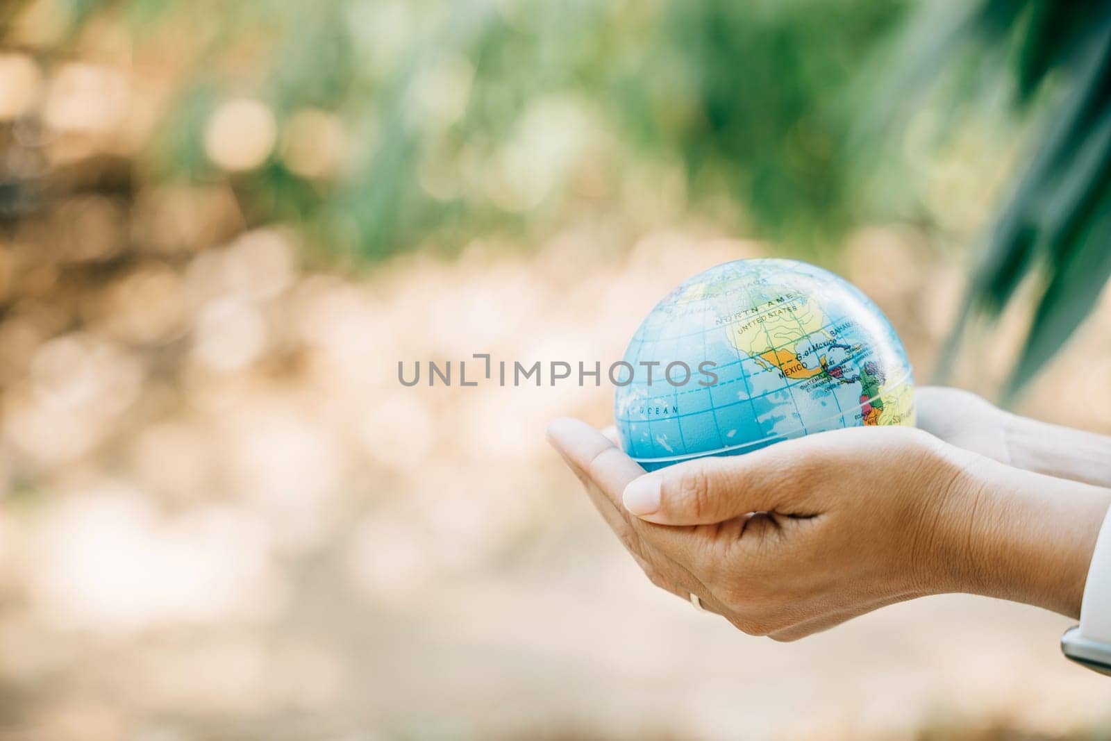 Grasp the Green Planet to Save Earth in this concept for Environment and Earth Day. It embodies responsibility, wisdom, and global support for our environment and nature.