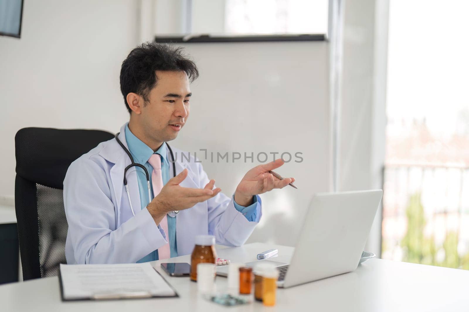 A healthcare professional provides guidance to a patient through a telemedicine platform, showcasing the modern approach to healthcare communication.