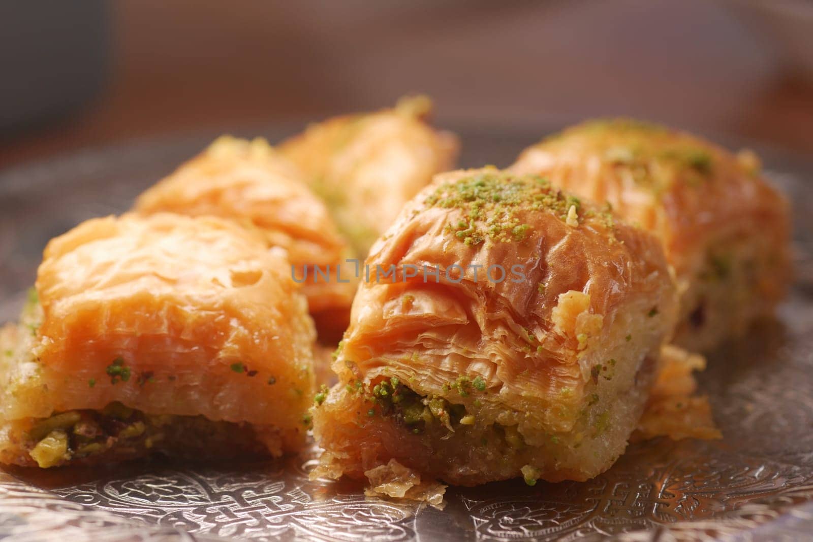 Delicious baklava pieces filled with nuts and drizzled with syrup