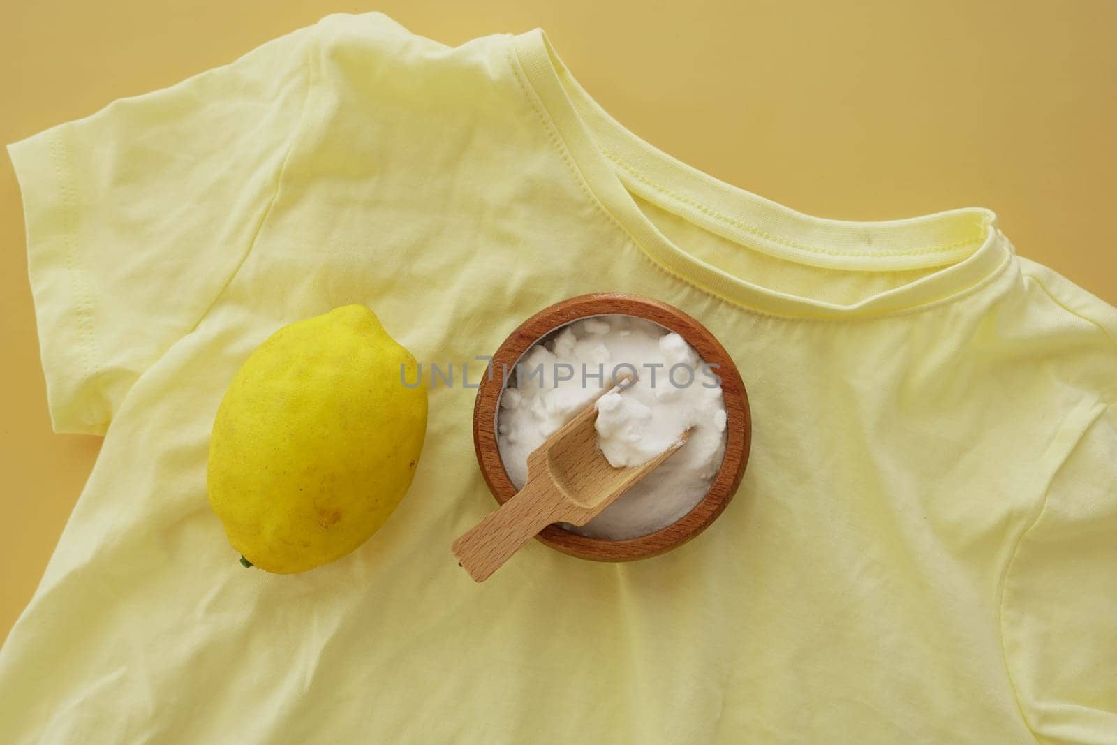 baking soda and lemon on yellow shirt ,