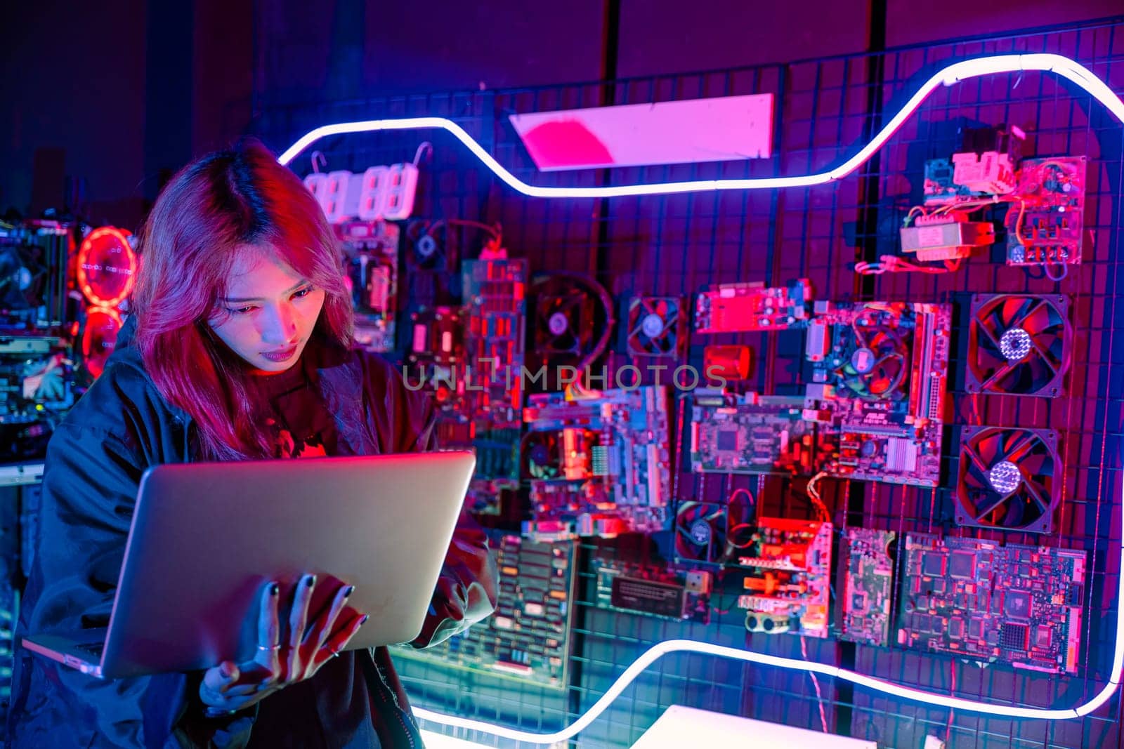 Asian woman is sitting at a desk with a laptop service in server room, Thinking and solve problems, Software engineer typing coding in laptop computer at data center, Cyber security