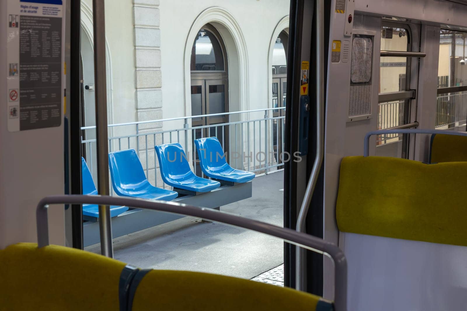 PARIS, FRANCE - February 23, 2025: View inside Paris Metro wagon of RER line, empty seats for passengers of transport system