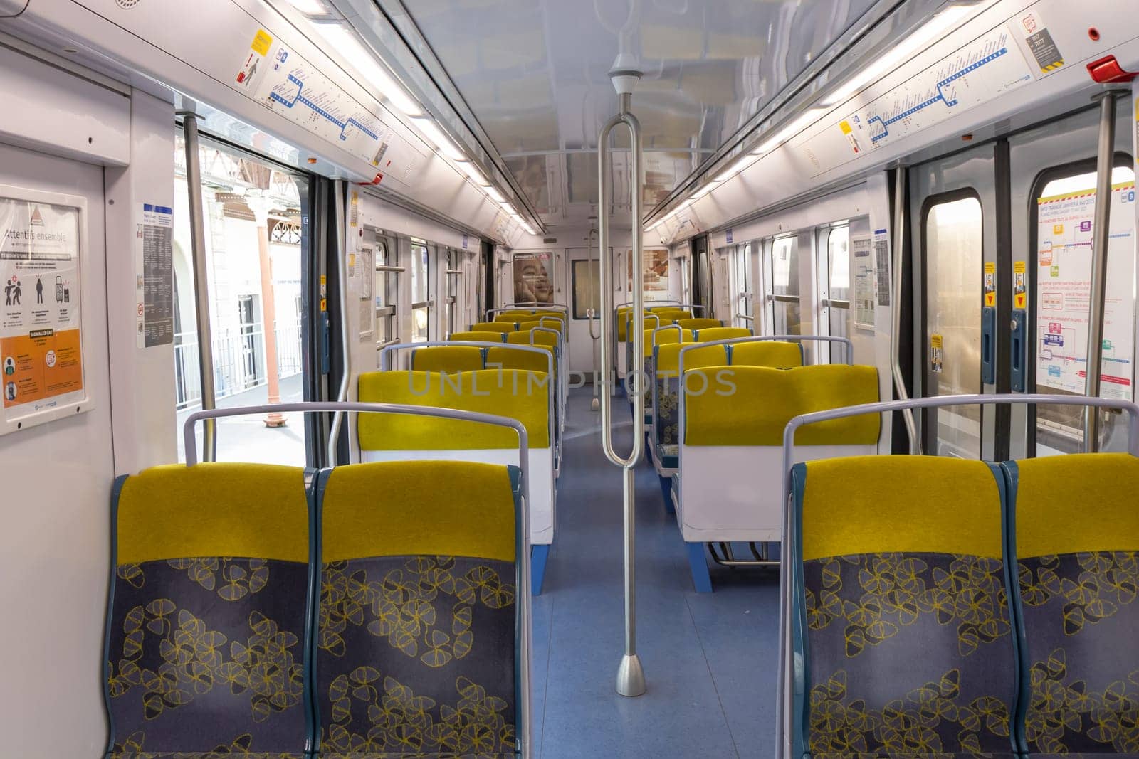 PARIS, FRANCE - February 23, 2025: View inside Paris Metro wagon of RER line, empty seats for passengers of transport system