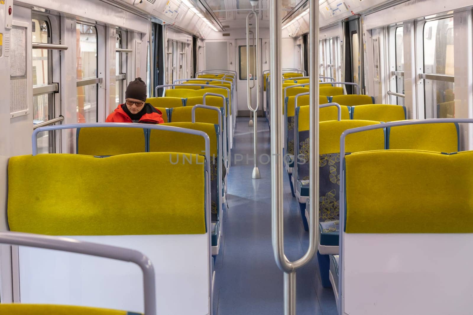 PARIS, FRANCE - February 23, 2025: View inside Paris Metro wagon of RER line, empty seats for passengers of transport system