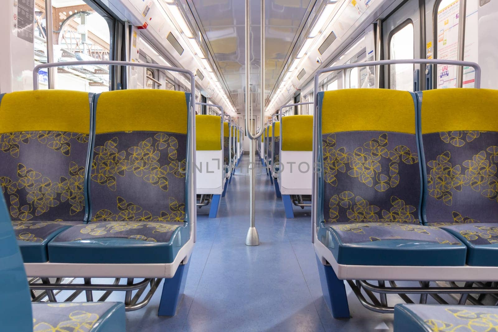 PARIS, FRANCE - February 23, 2025: View inside Paris Metro wagon of RER line, empty seats for passengers of transport system