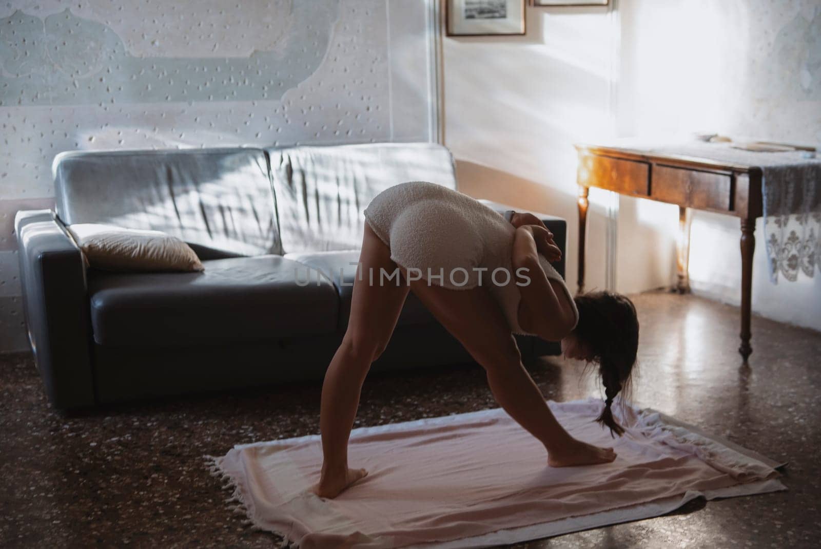 A serene yoga practice captured in the soft glow of morning light, promoting tranquility and mindfulness.