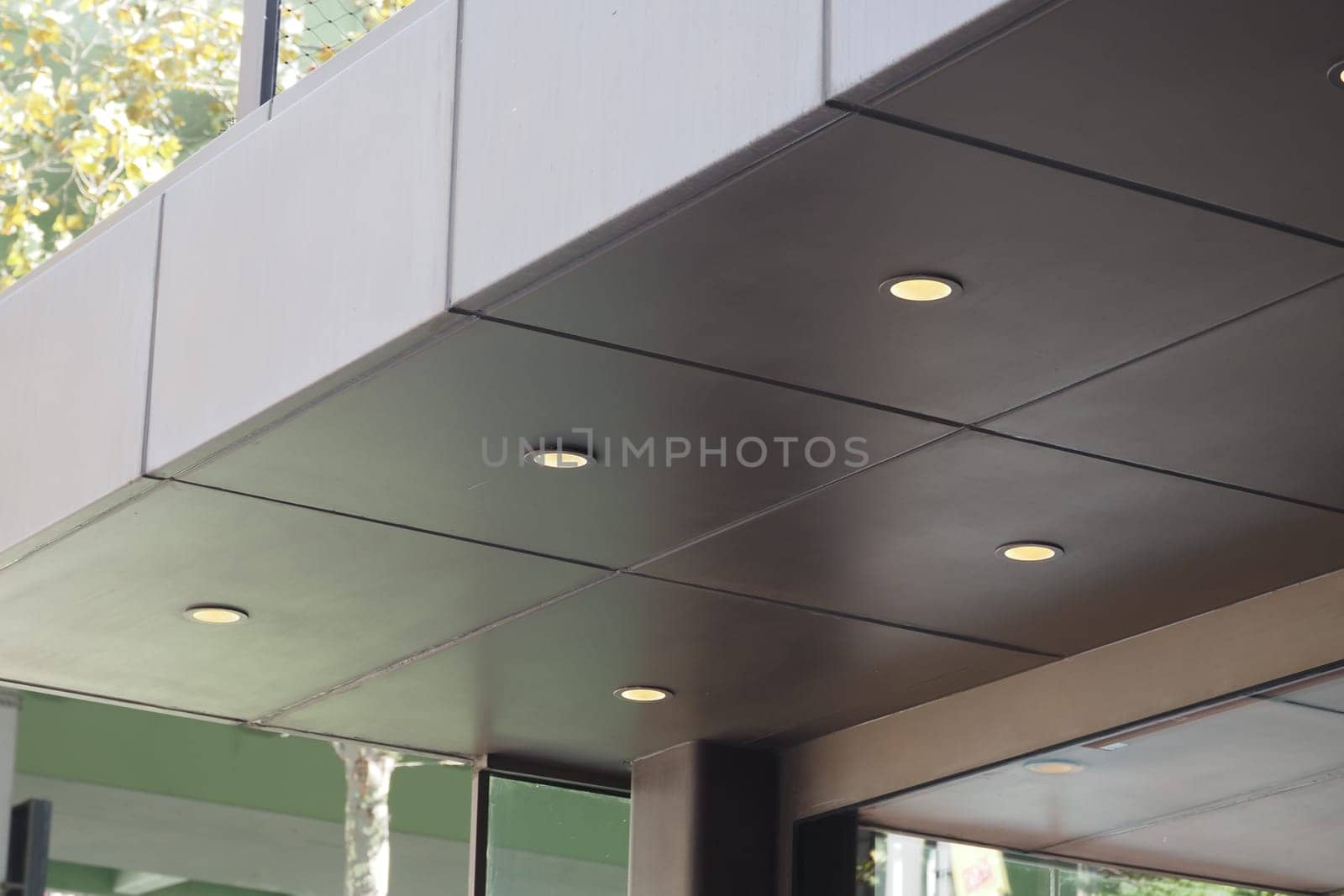 Sleek ceiling design featuring recessed lighting in a contemporary space.