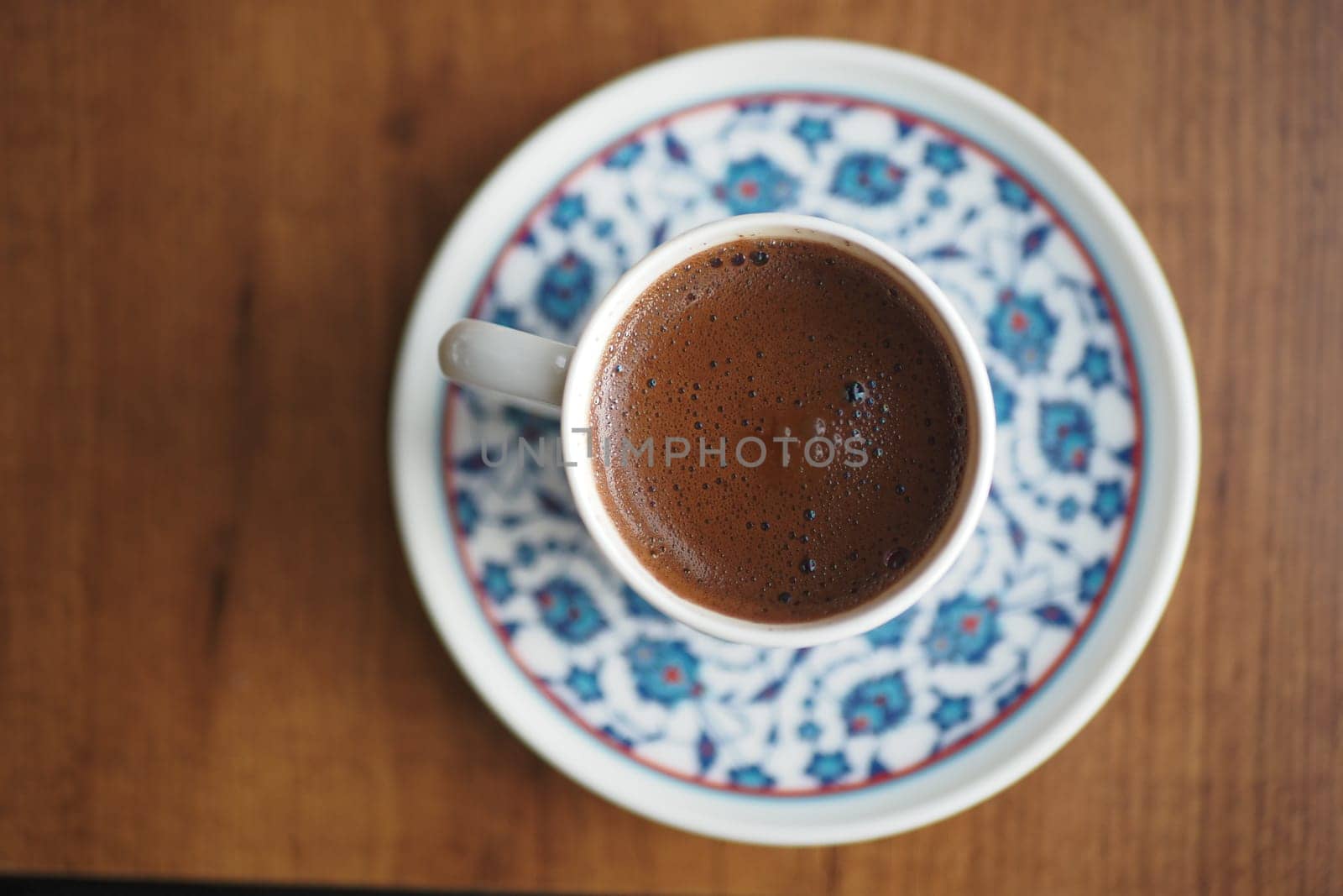 Enjoying a cup of turkish coffee in a cozy setting,