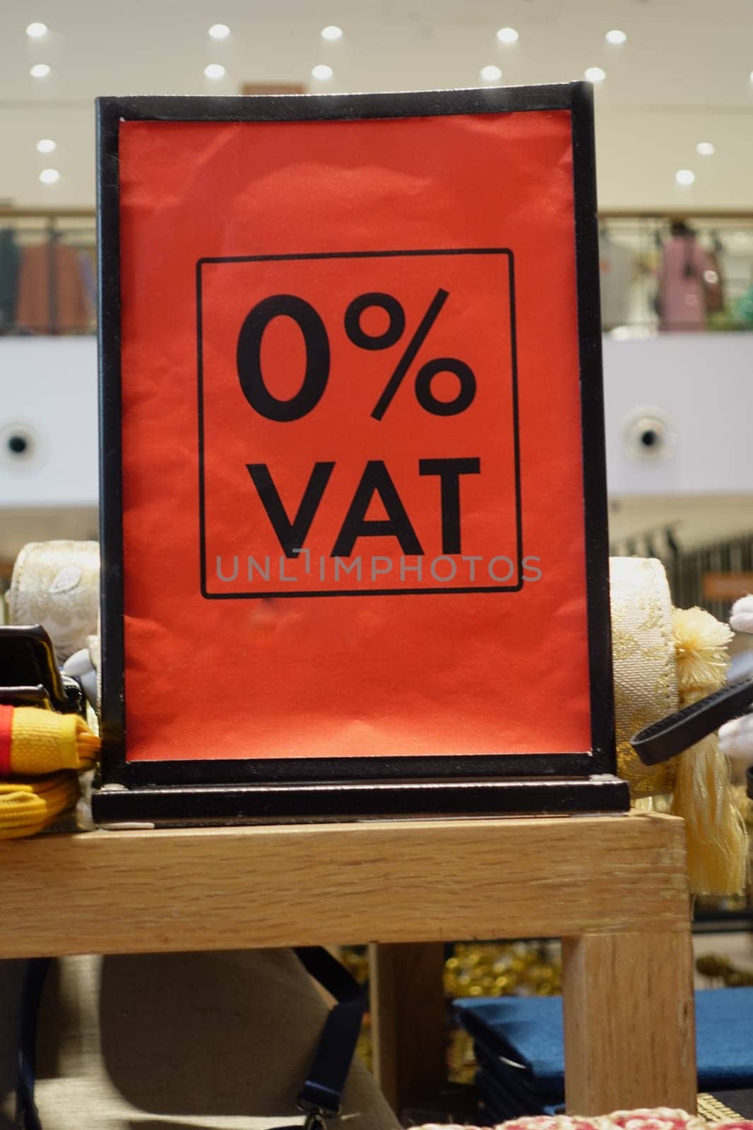 Bright red sign indicates zero value-added tax on merchandise inside the store.