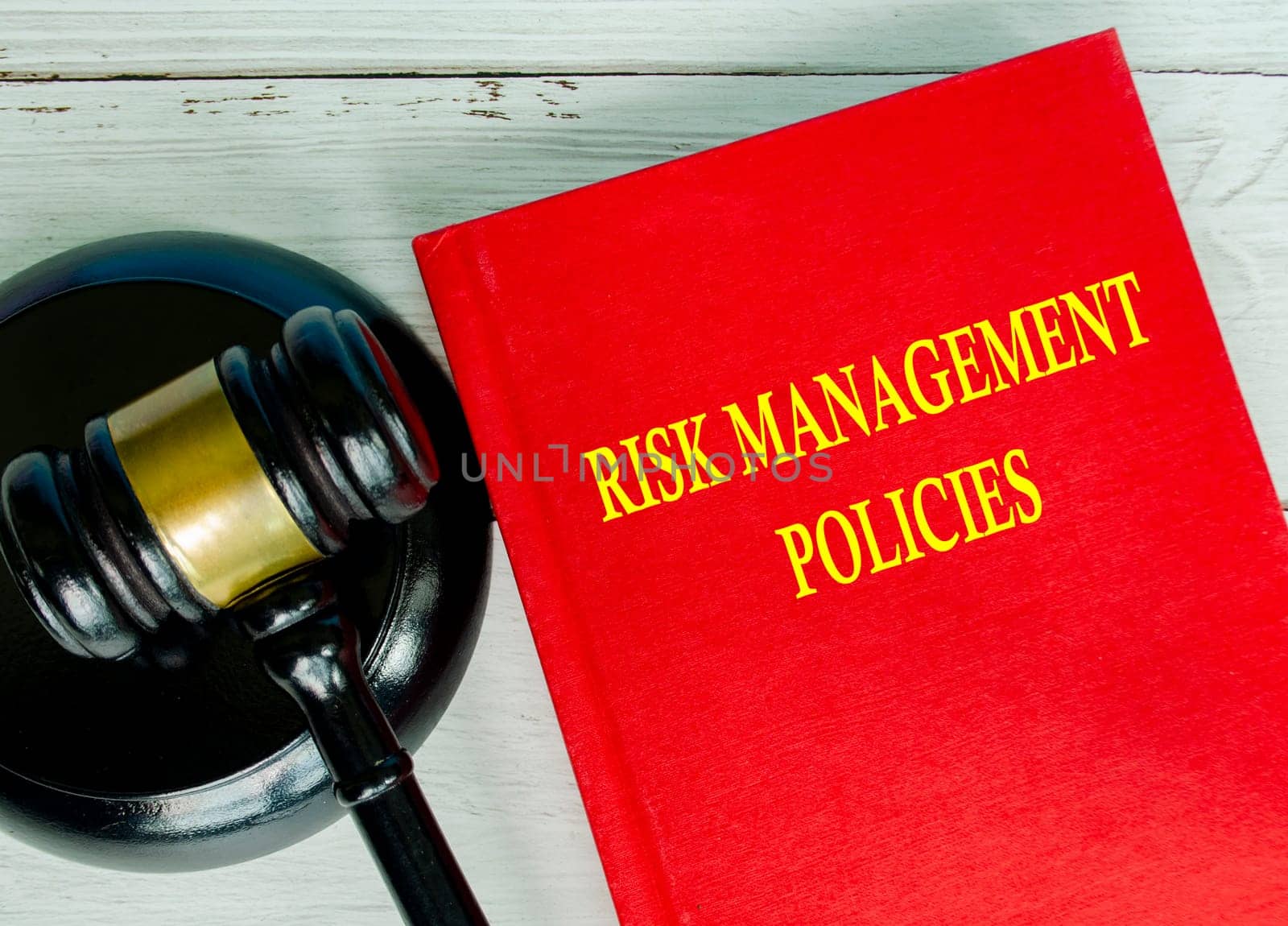 Top view of Risk Management Policies book with gavel background.