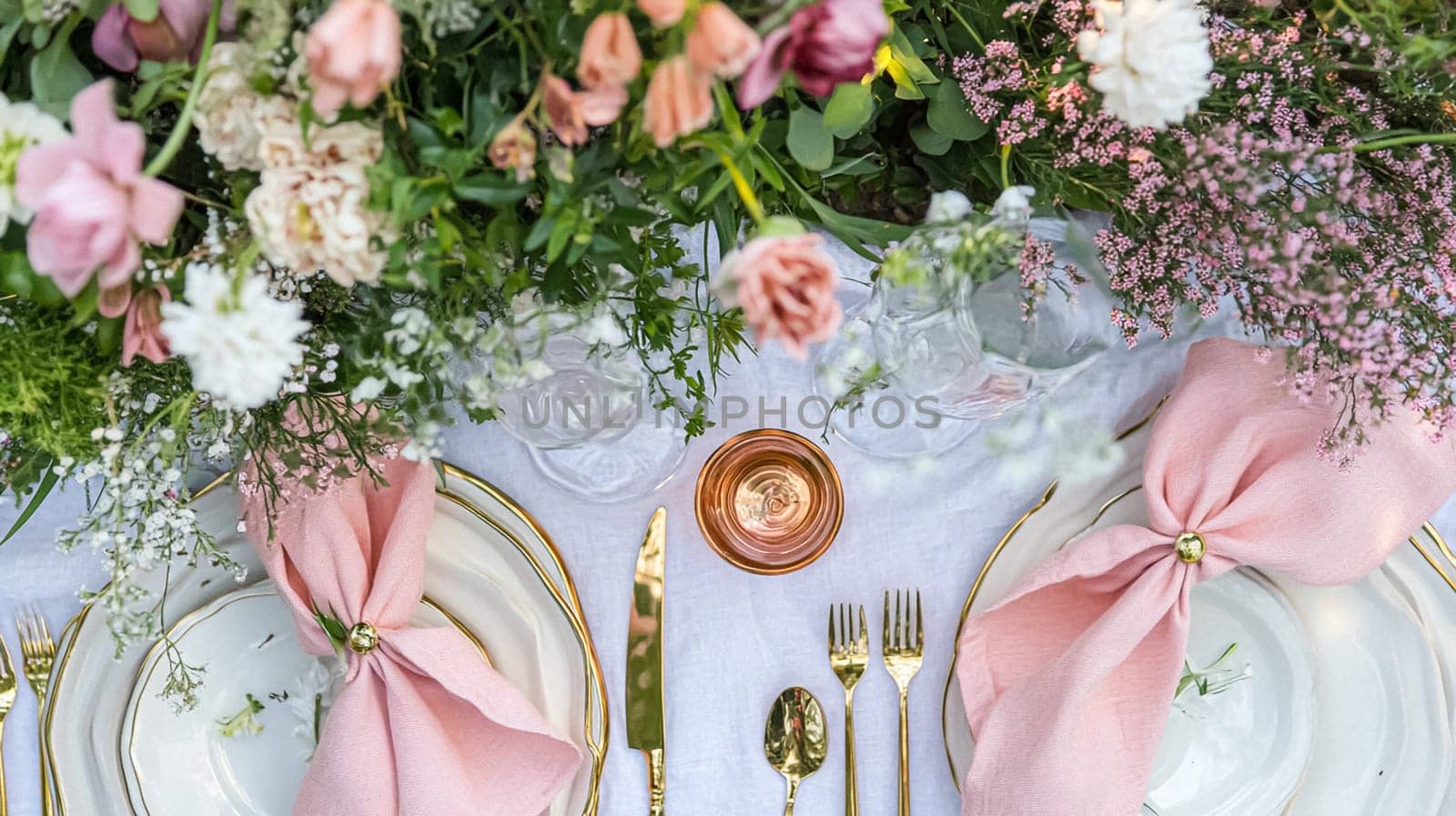 Sunlit tablescapes adorned with delicate floral arrangements, elegant glassware, and fine china. Set in lush gardens, each scene captures the charm of alfresco dining idea