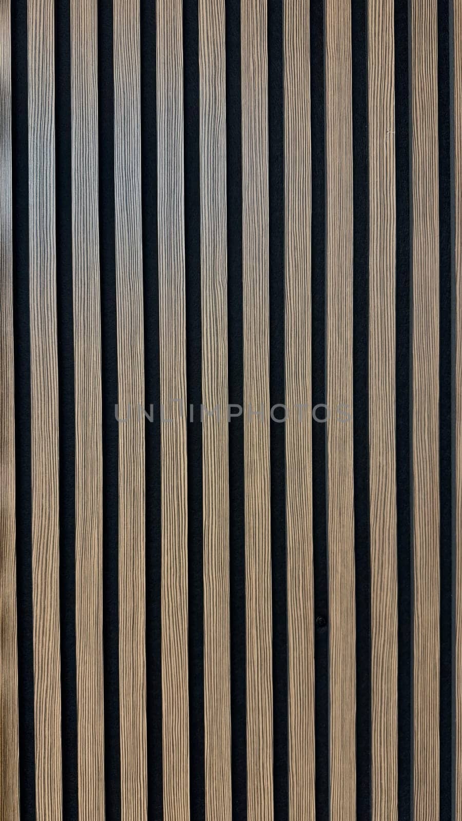 Modern Wooden Panel with Vertical Striped Design for Contemporary Interiors. A close-up view of a wooden panel featuring vertical striped patterns in a modern design, perfect for architectural and interior design concepts emphasizing simplicity, texture, and elegance. Can be used like background.