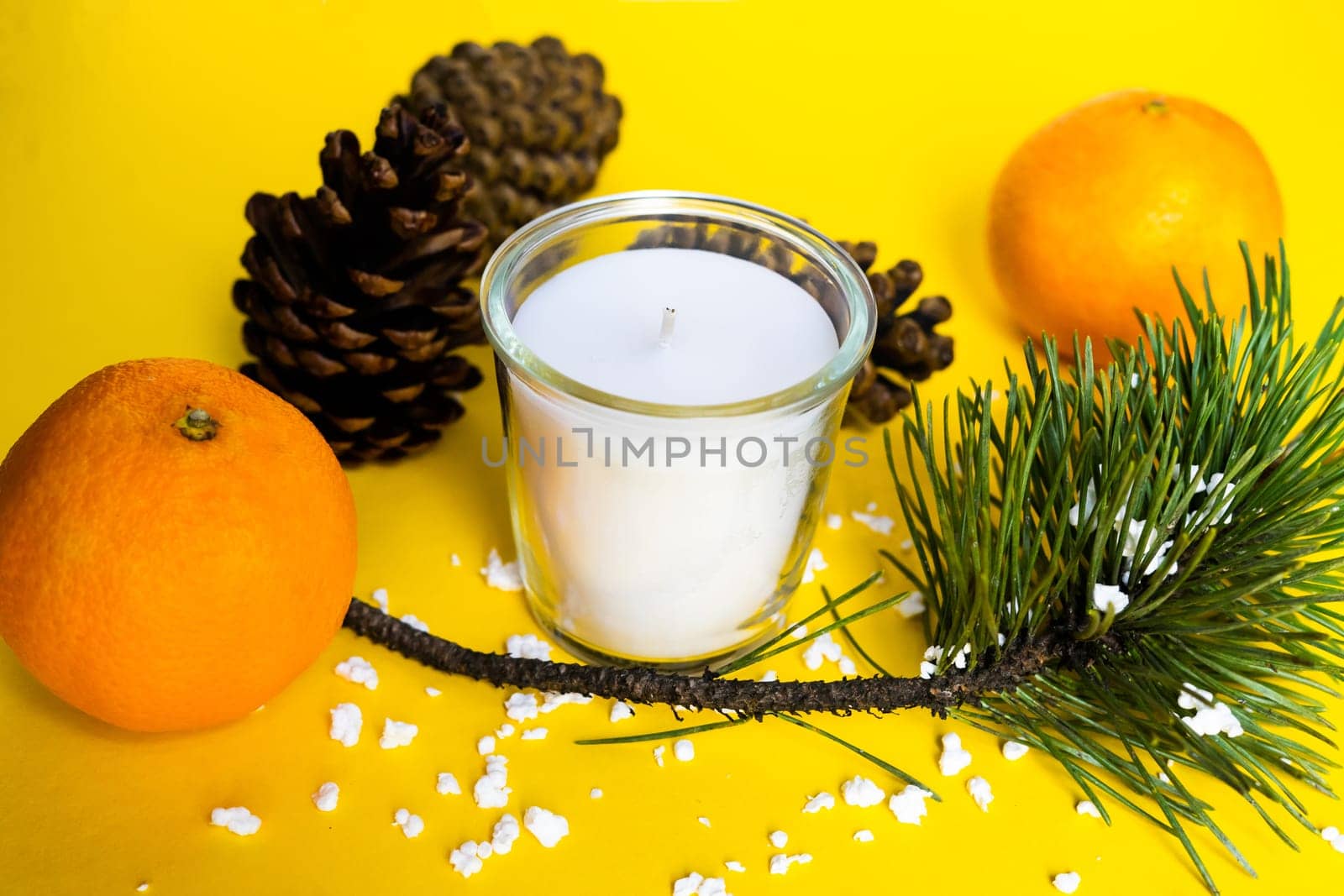 Christmas background with a fir tree branches and tangerines. Merry Christmas and Happy New Year