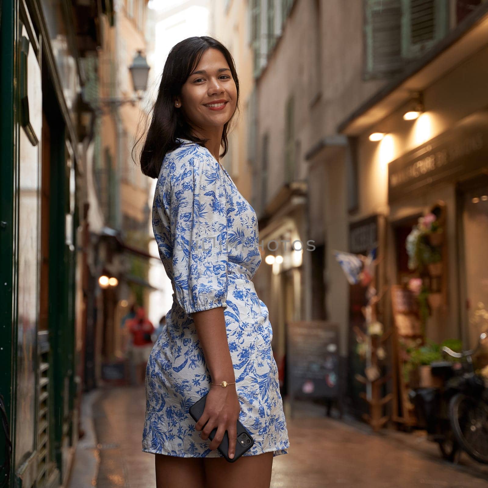 Beautiful young mixed race woman in the old town of Nice