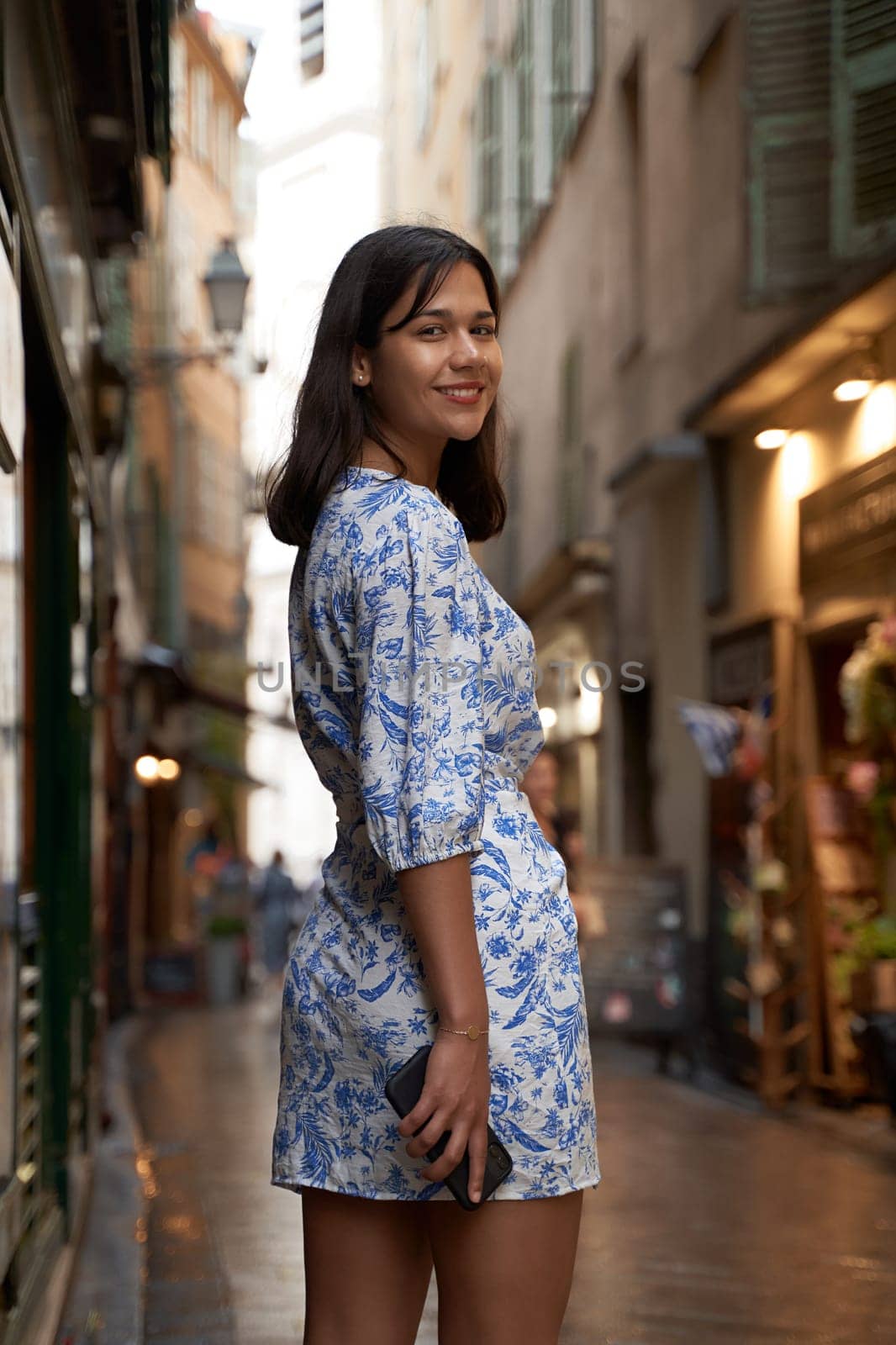 Beautiful young mixed race woman in the old town of Nice