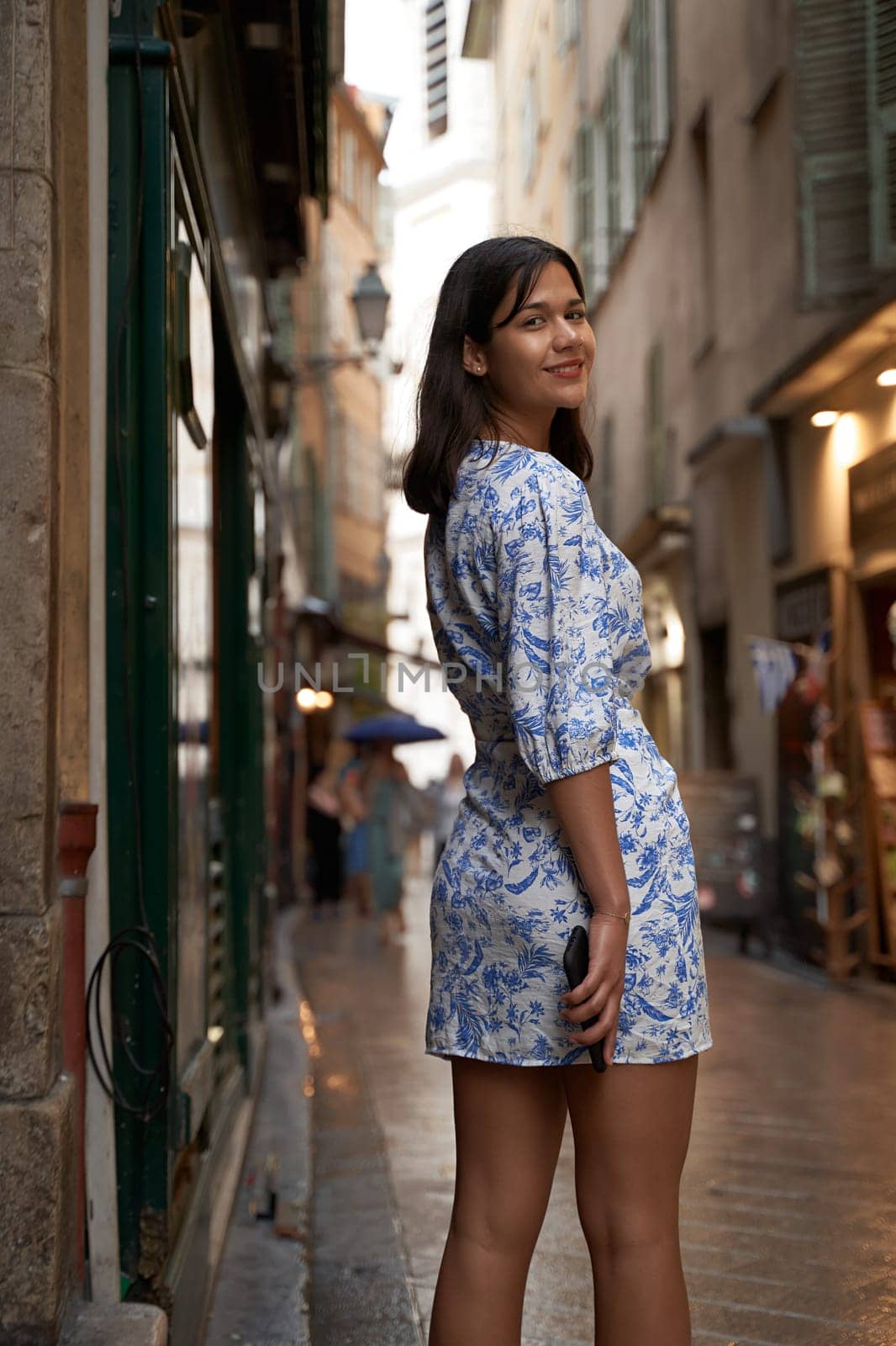 Beautiful young mixed race woman in the old town of Nice