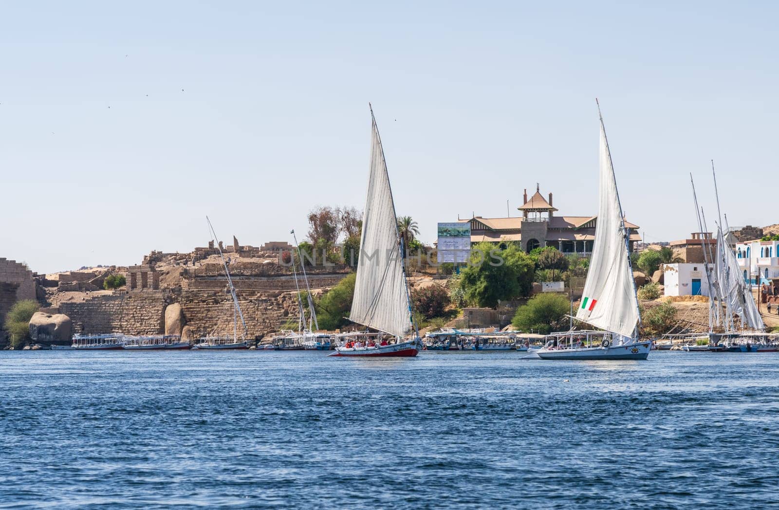 Aswan, Egypt - 4 November 2024: Aswan Museum in Elephantine, by the Nile. Felluca sail by the ruins of Abu