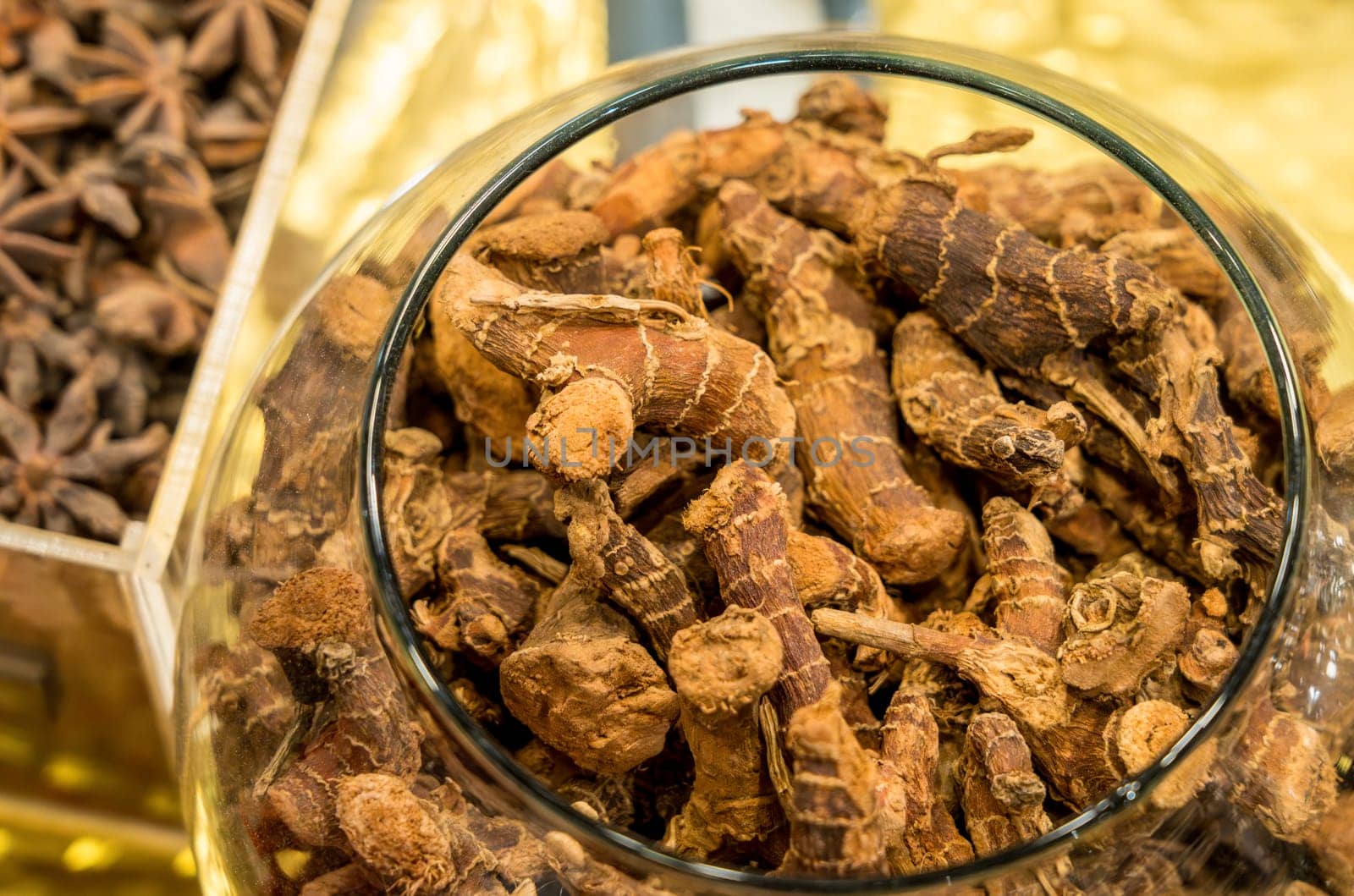 Glass jar of turmeric, or Curcuma longa, is a flowering plant in the ginger family Zingiberaceae in Egypt