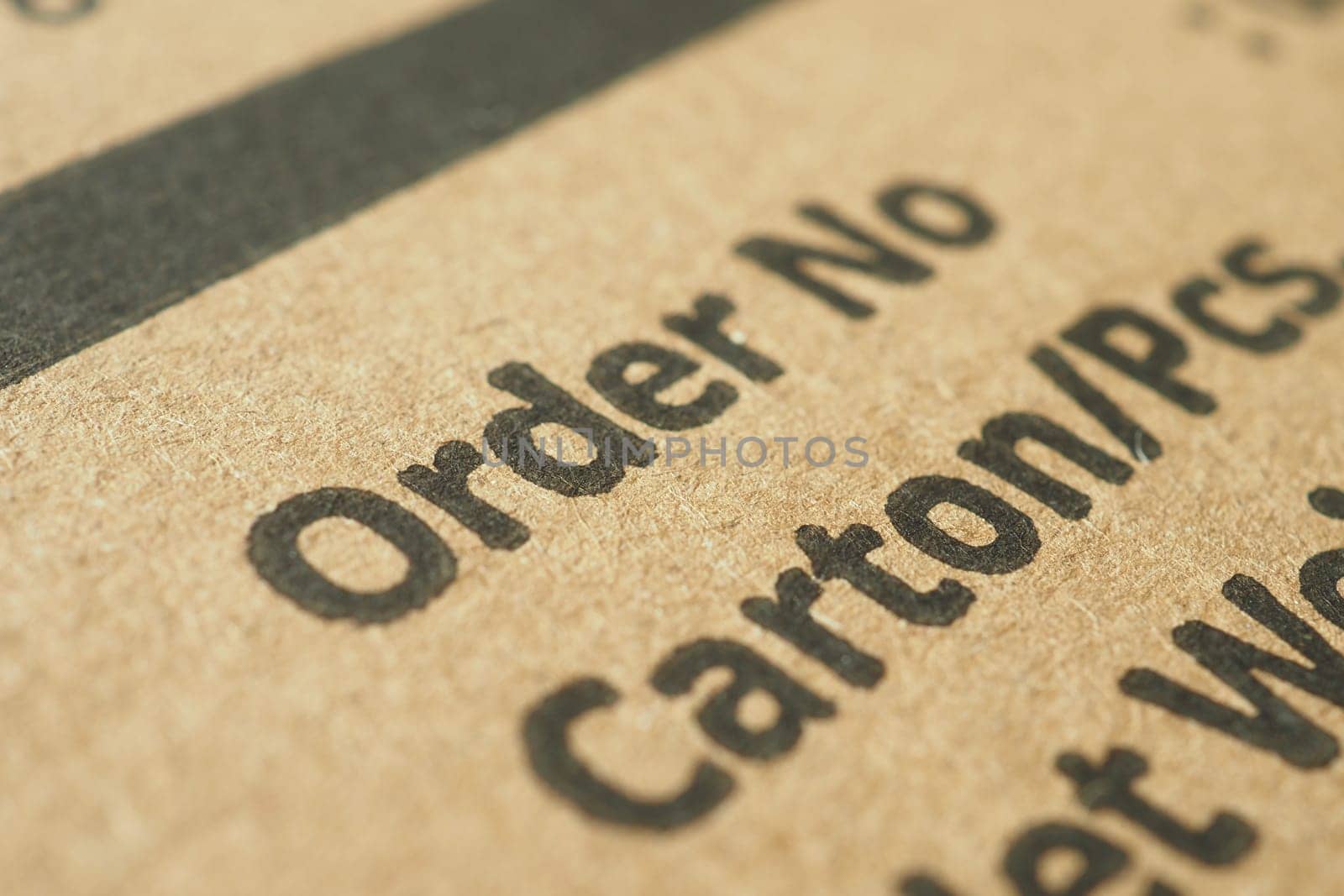 Close-up view of delivery order information printed on a carton.