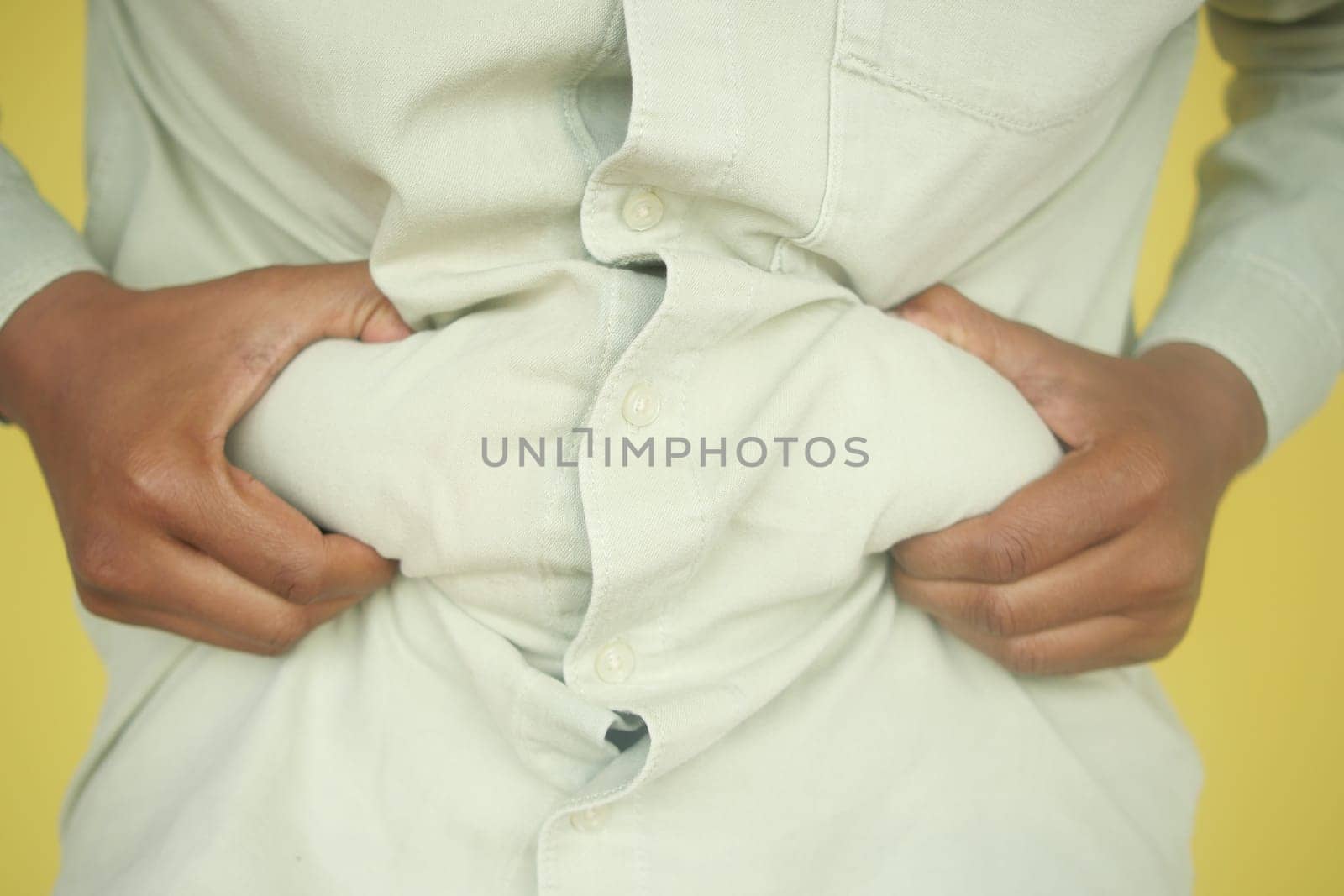 hand gripping excessive belly fat ,