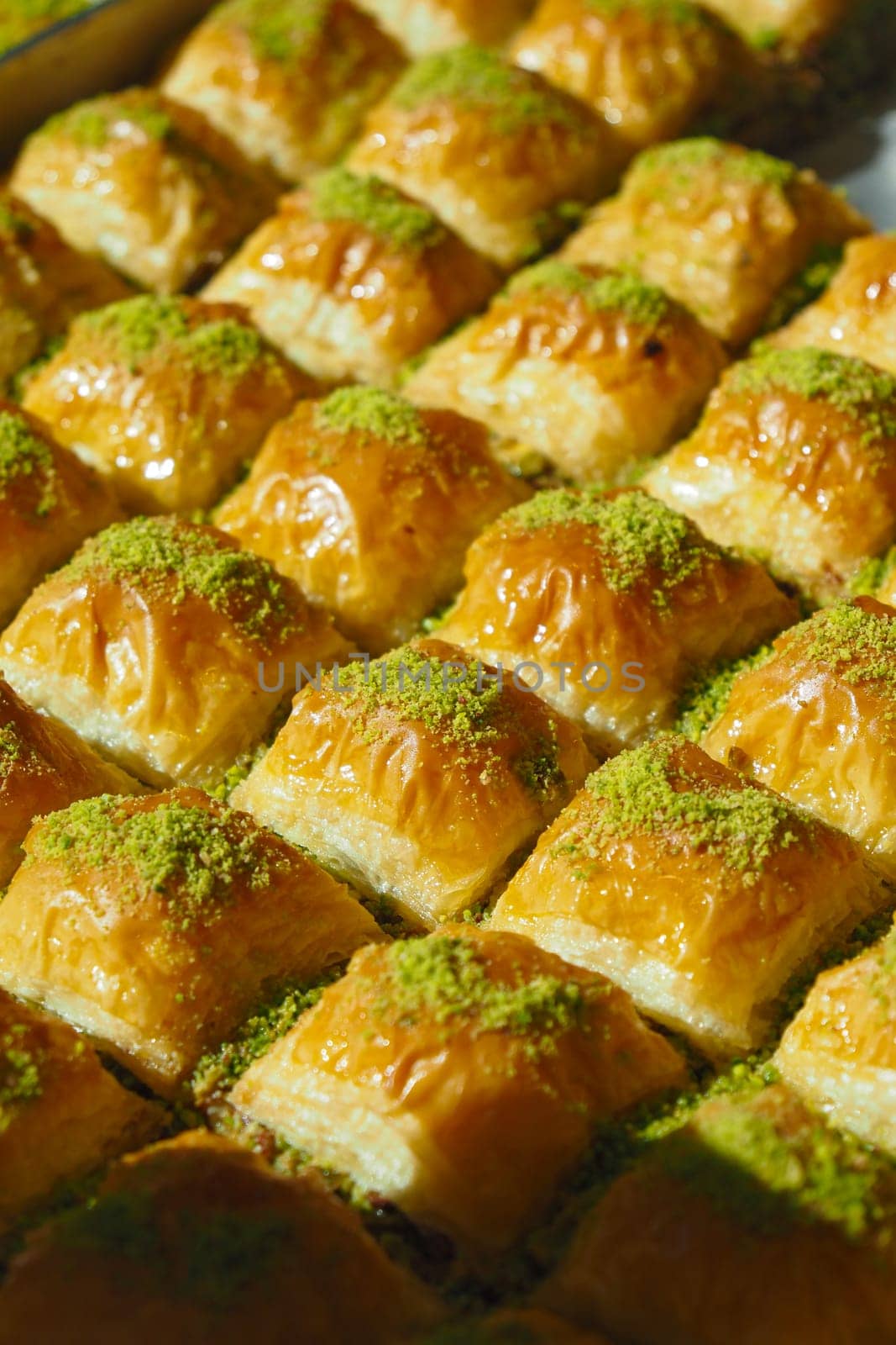 Freshly made baklava topped with pistachios at the market stall today.