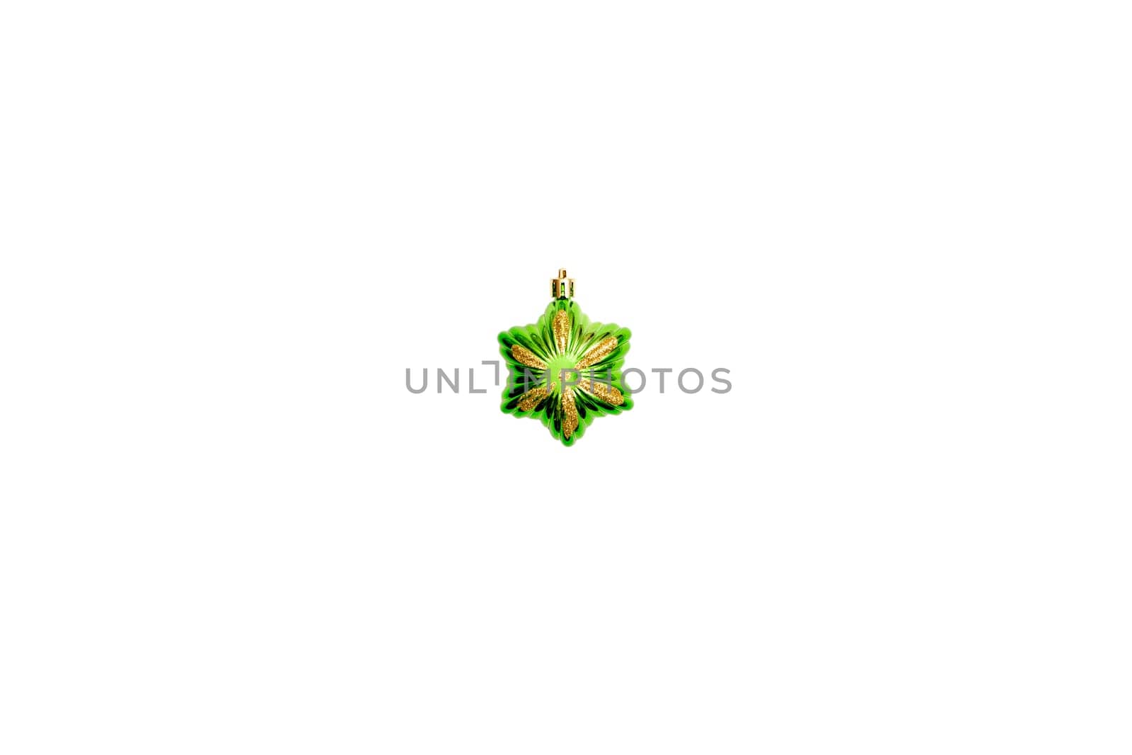 Green shiny Christmas tree toy star isolated on white background.Details for new year and Christmas holidays atmosphere, design of greeting card banner.