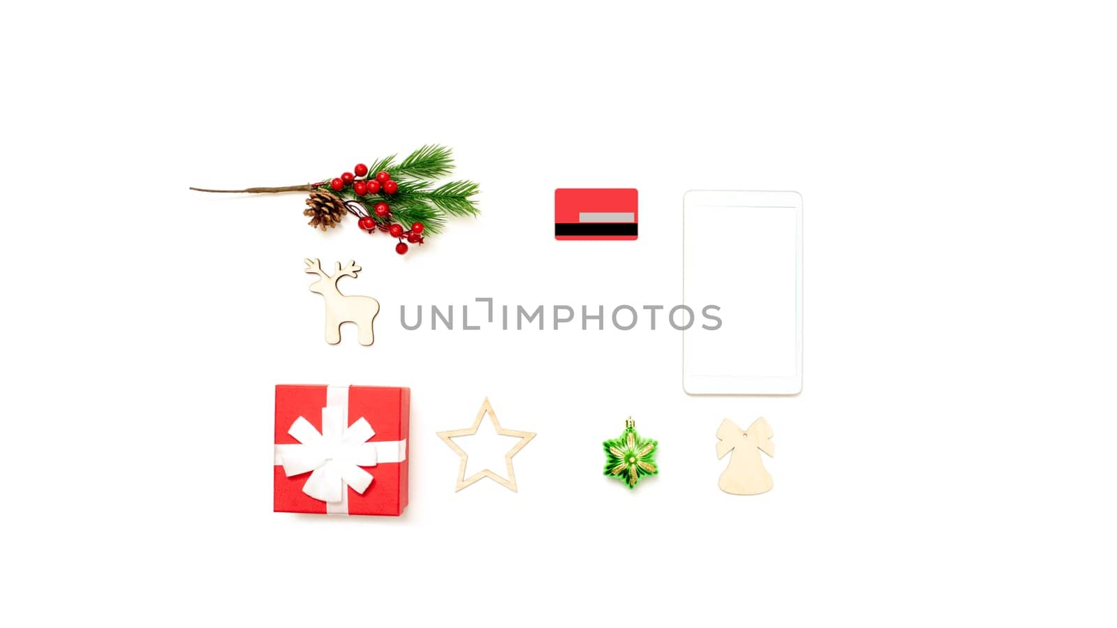 Wide banner with digital tablet with copy space on top on white table, credit card, gift box and christmas toys. Online shopping concept in christmas. Mock up. Copy space.Top view