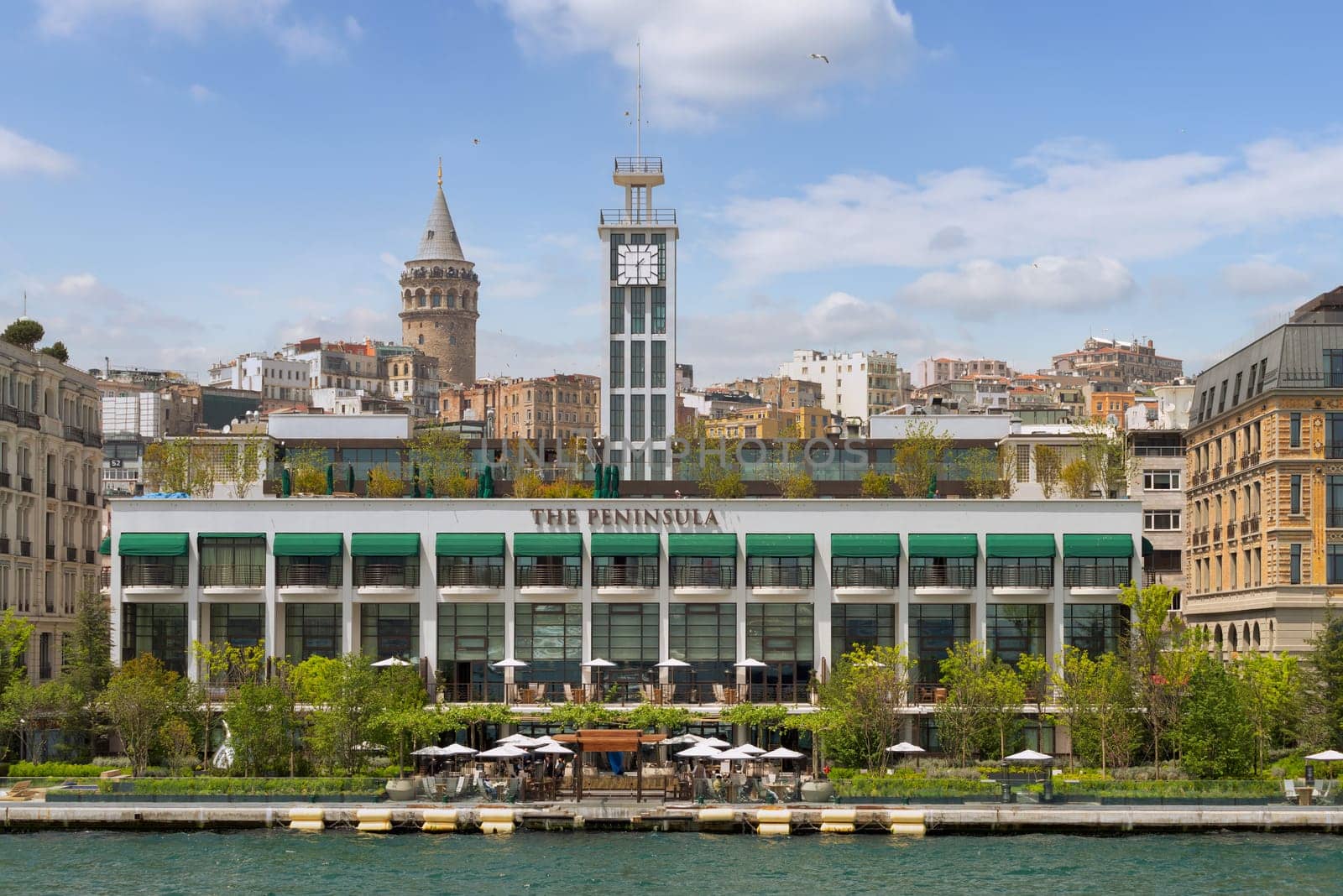 Istanbul, Turkey - May 8 2023: Exterior of modern architectural design building of Grand Tarabya five stars hotel, suited by Bosphorus Strait, at Sariyer district, in a summer day
