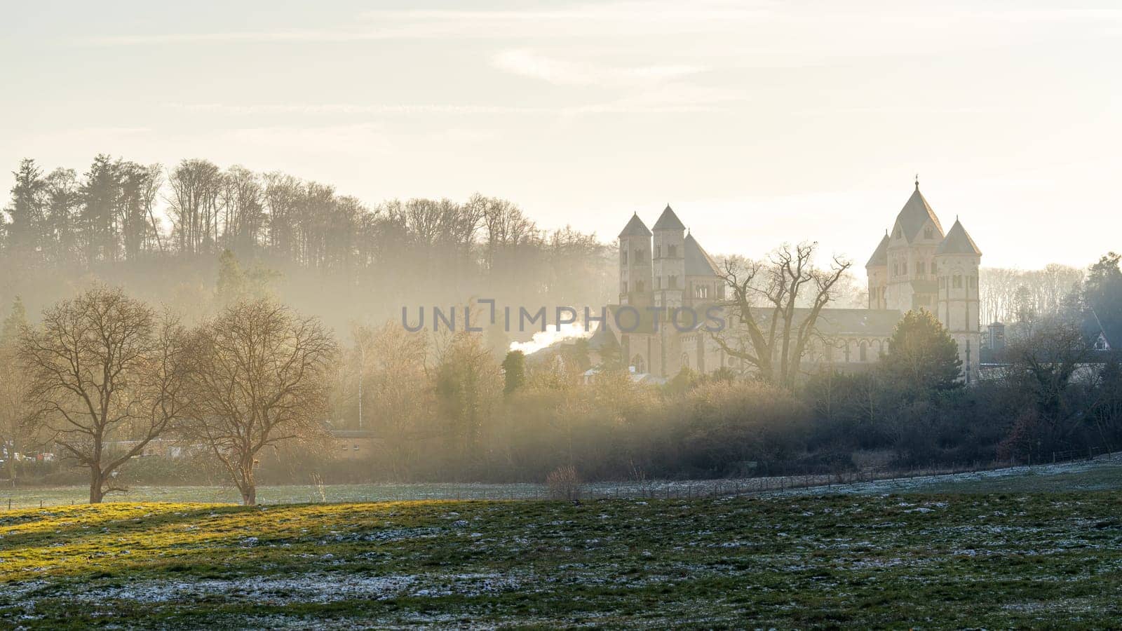 Maria Laach, Germany - January 10, 2024: Panoramic image of monastery church Maria Laach in morning light on January 10, 2024 in Rhineland-Palatinate, Germany