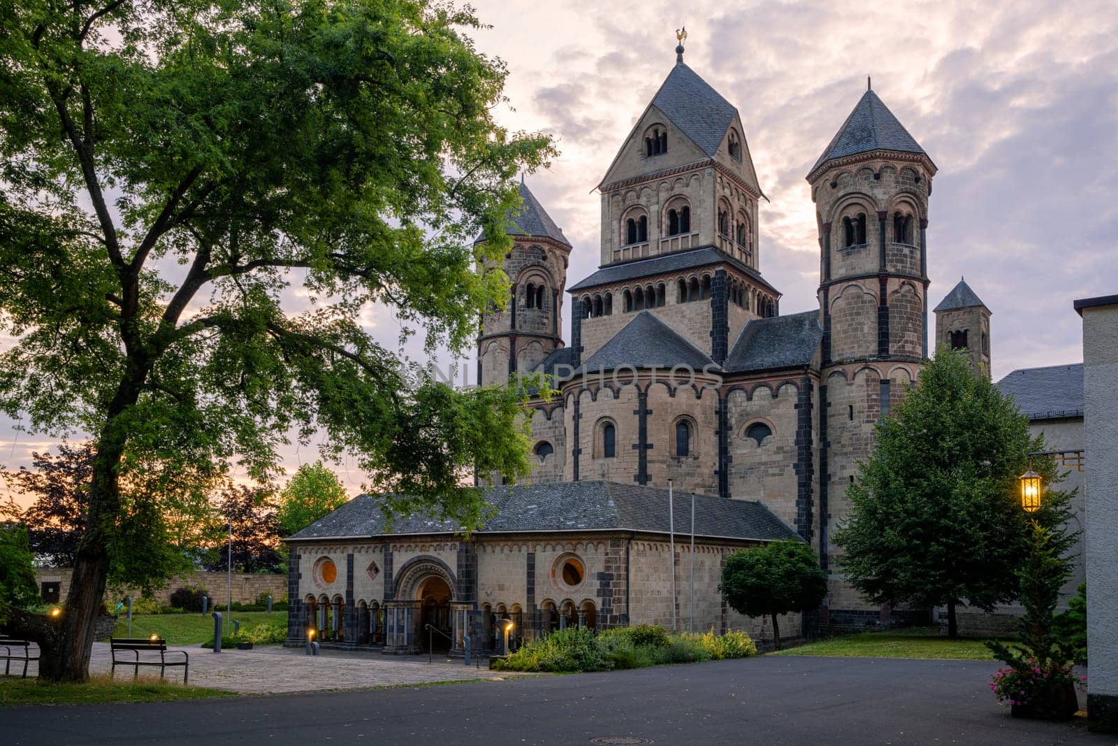 Maria Laach, Germany - July 31, 2024: Panoramic image of monastery church Maria Laach in morning light on July 31, 2024 in Rhineland-Palatinate, Germany