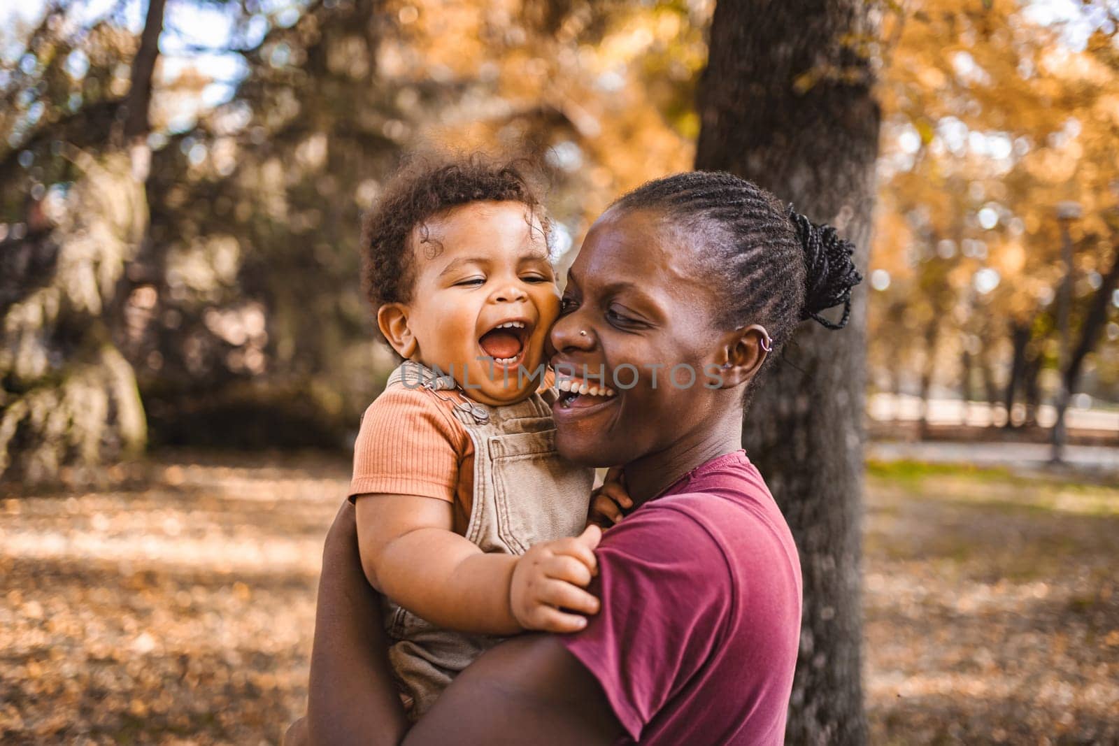 Mother's Embrace: Joyful Moments in the Park.