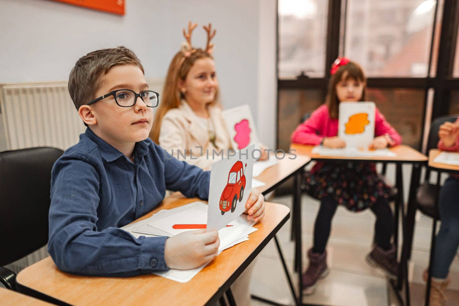 Group of elementary students learning together at language school.