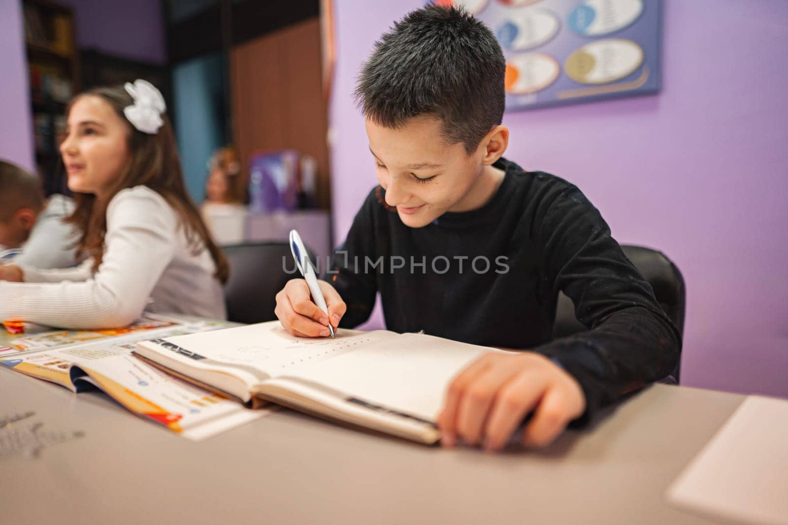 Two elementary students learning together at language school.