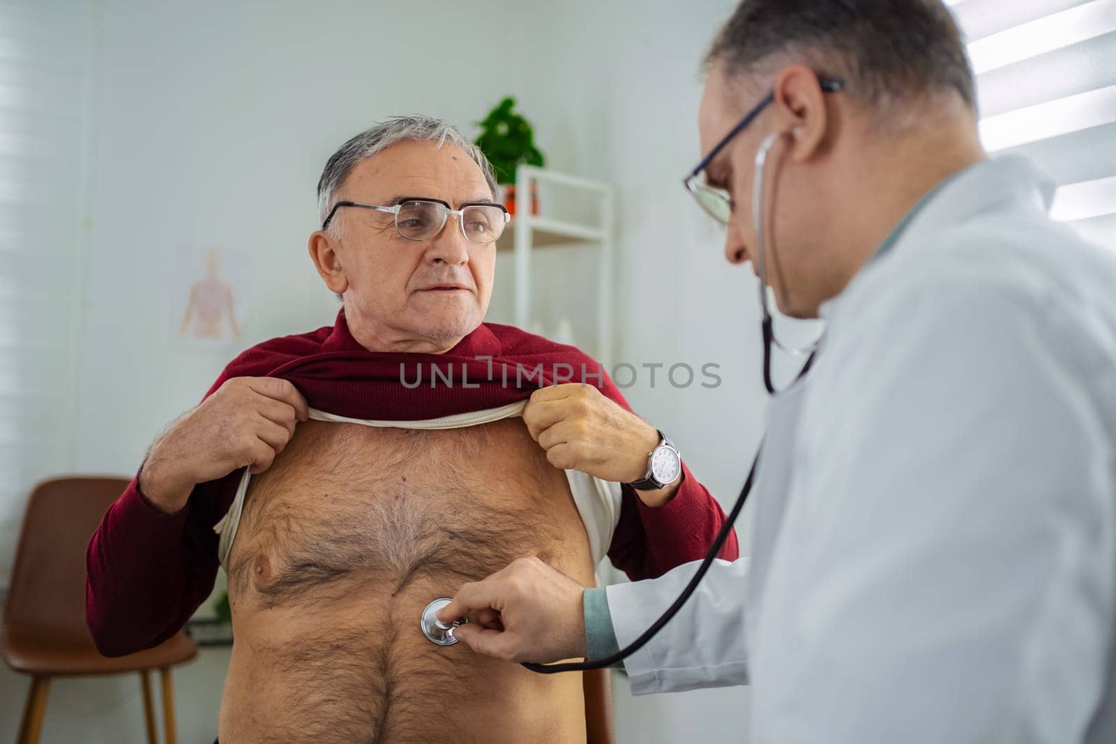 Doctor conducts a health examination for an elderly patient.