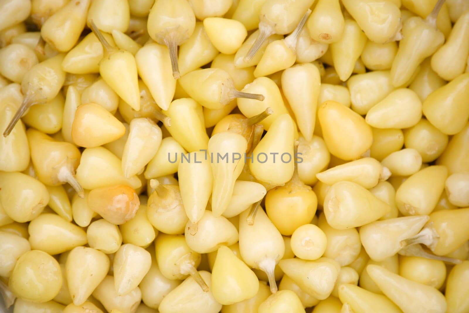 Close-Up of Fresh Yellow Chili Peppers in a Pile.