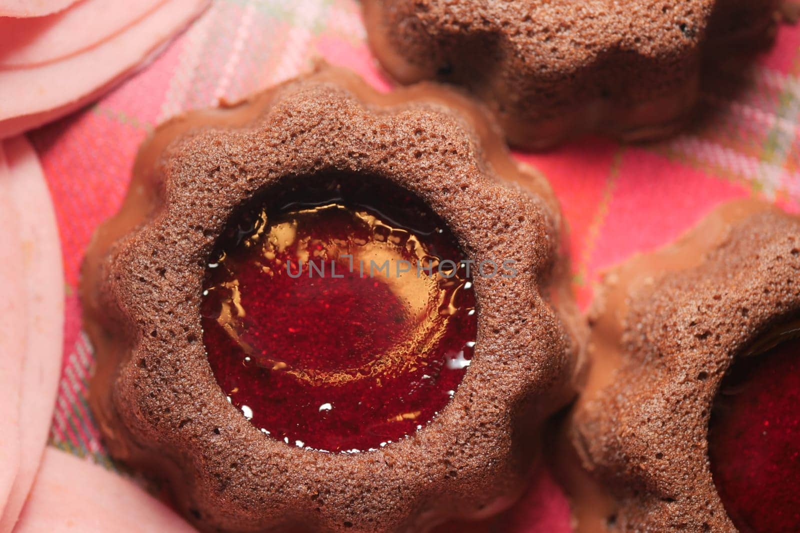 Sweets feature chocolate texture with vibrant jelly center on fabric.