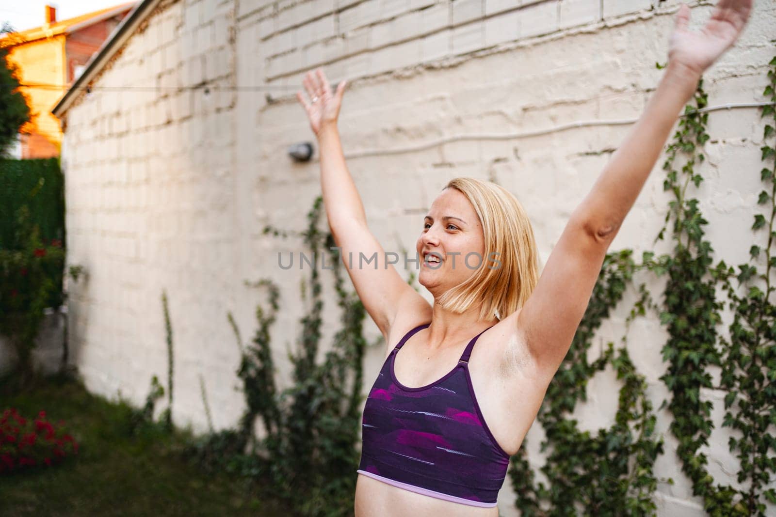Energetic mother enjoys workout outdoors to boost her confidence post-birth.