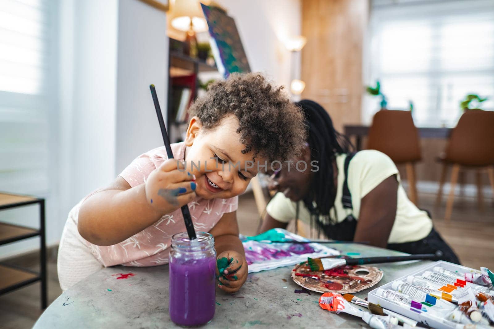 Little artists explore their creativity with vibrant colors and laughter.