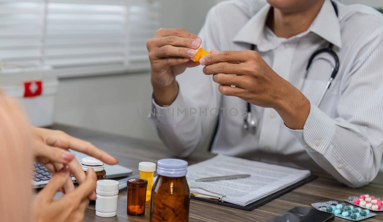 The healthcare provider carefully explains the patient's medications, ensuring a clear understanding of their treatment plan.