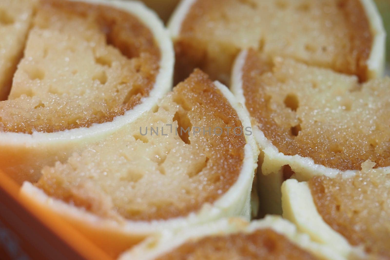 indian sweet dessert rolls served on a wooden platter.