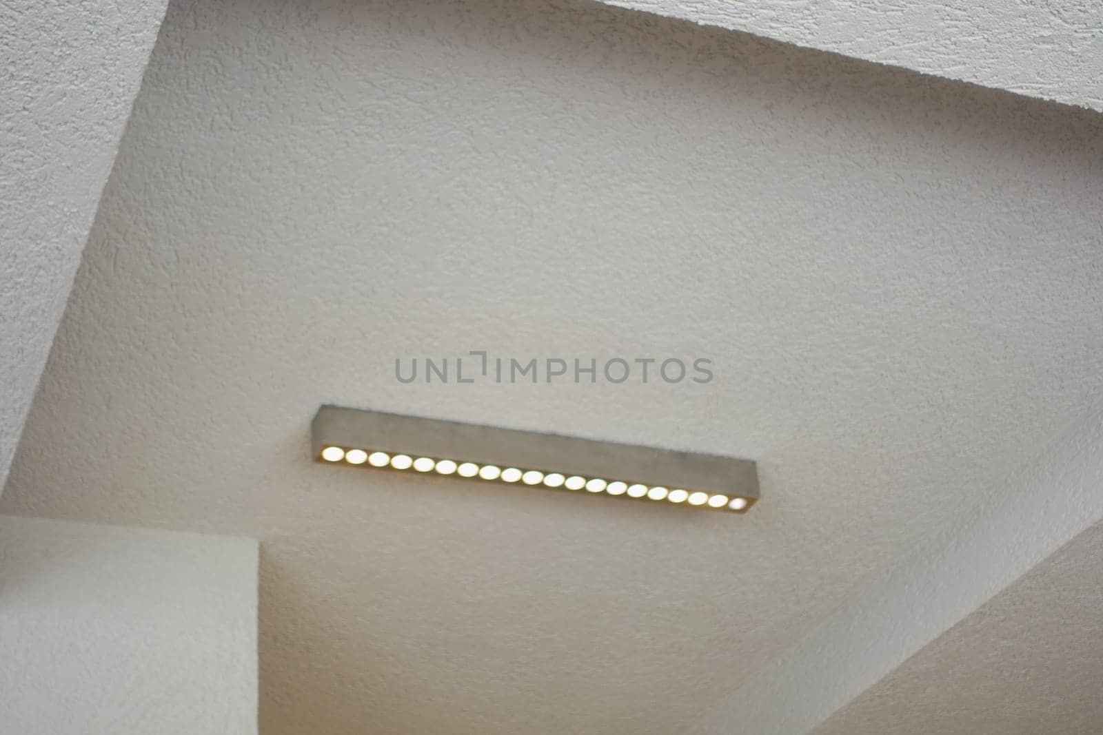 Bright LED light fixture enhances the aesthetic of a clean, simple space.